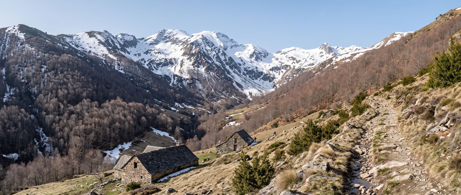 Évocation : haute vallée pyrénéenne au printemps, neige sur les sommets, une grange de pierre et un sentier montant vers la frontière